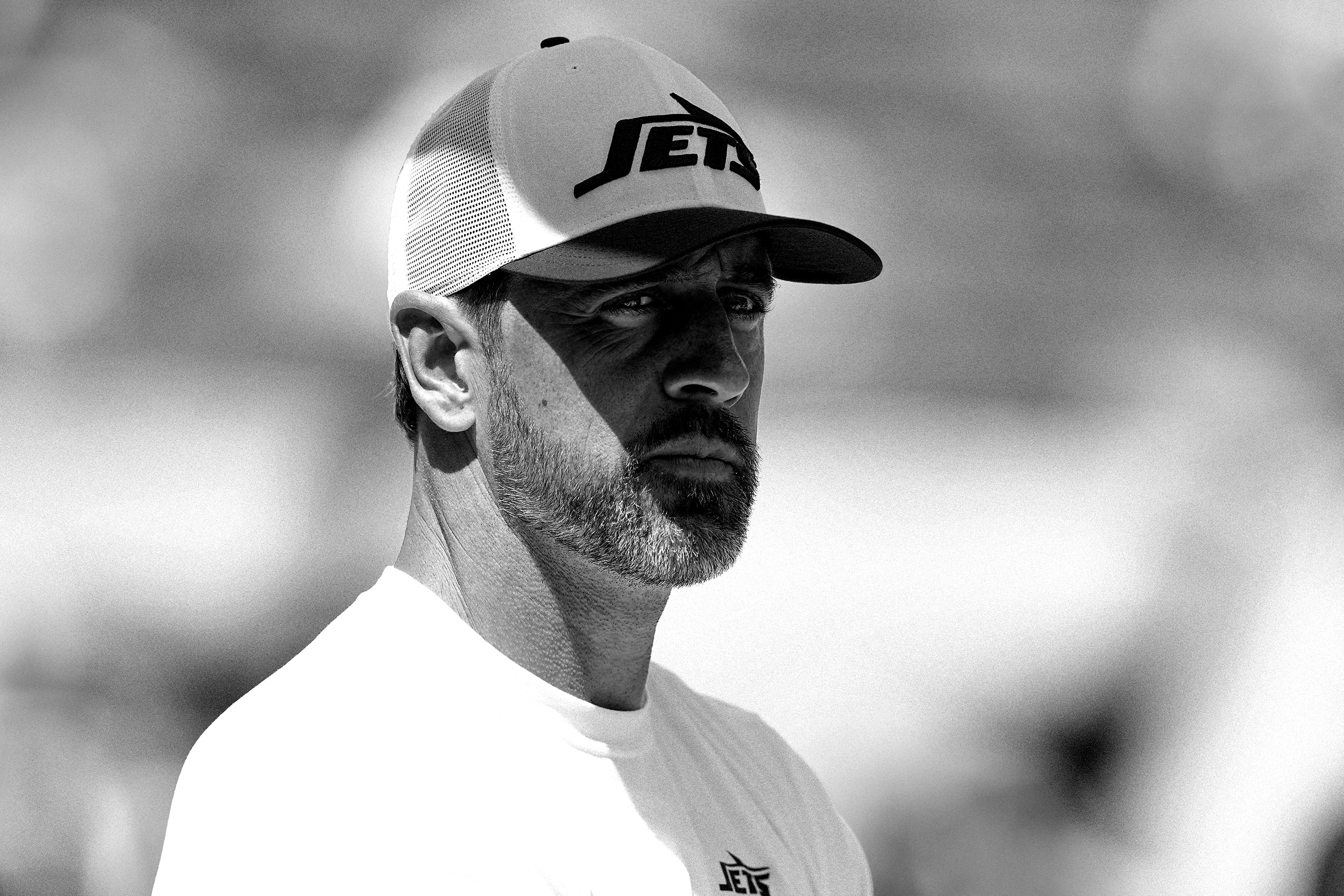 Image may contain Aaron Rodgers Baseball Cap Cap Clothing Hat Adult Person People Face Head and Photography